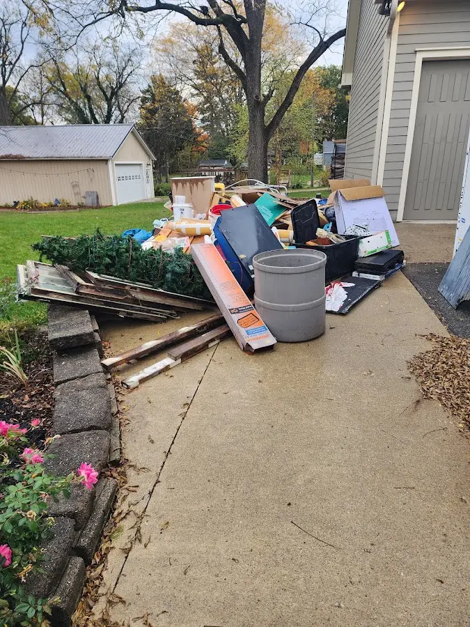 Dumpster being loaded with debris for Residential Dumpster Rental in Strafford